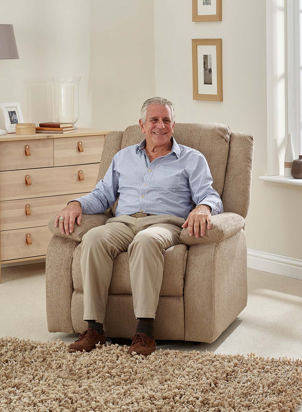 MaxiComfort Oasis Fabric Riser Recliner in use