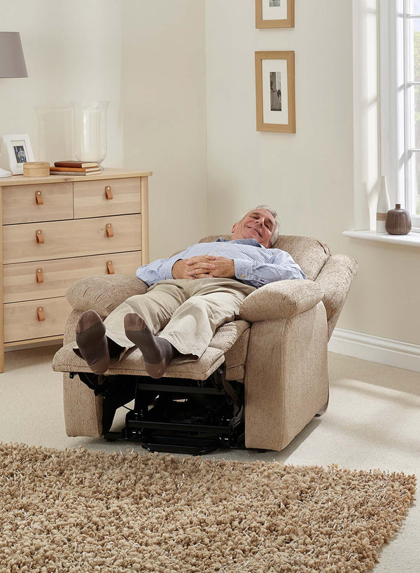 MaxiComfort Oasis Fabric Riser Recliner in use
