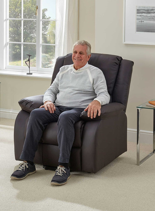 MaxiComfort Oasis Leather Riser Recliner in use
