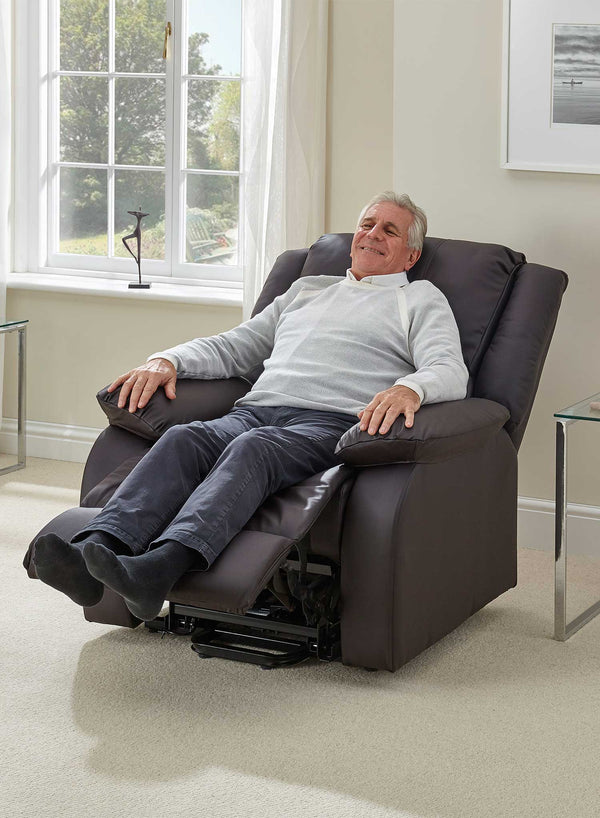 MaxiComfort Oasis Leather Riser Recliner in use