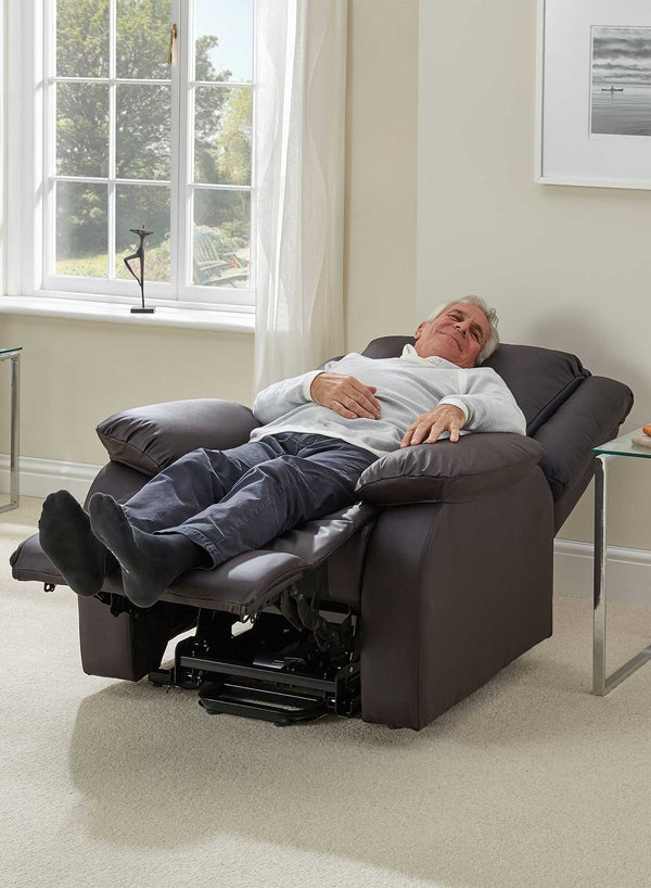 MaxiComfort Oasis Leather Riser Recliner in use