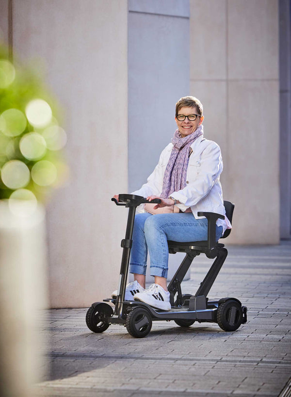 Pride GoGo Carbon Folding Scooter in use