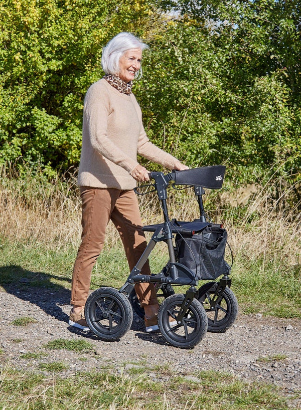 Traxion Outdoor Rollator in use