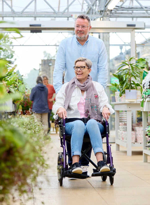 CareCo Infiniti Transit Wheelchair in use