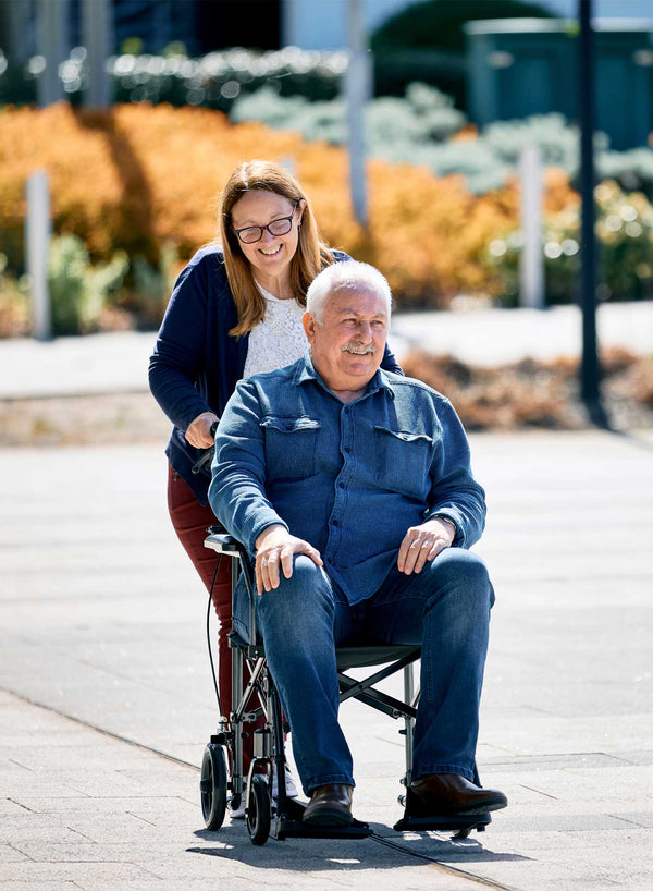 CareCo Travel Air Compact Wheelchair in use