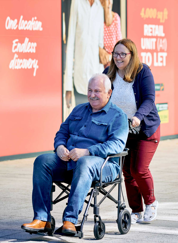 CareCo Travel Air Compact Wheelchair in use