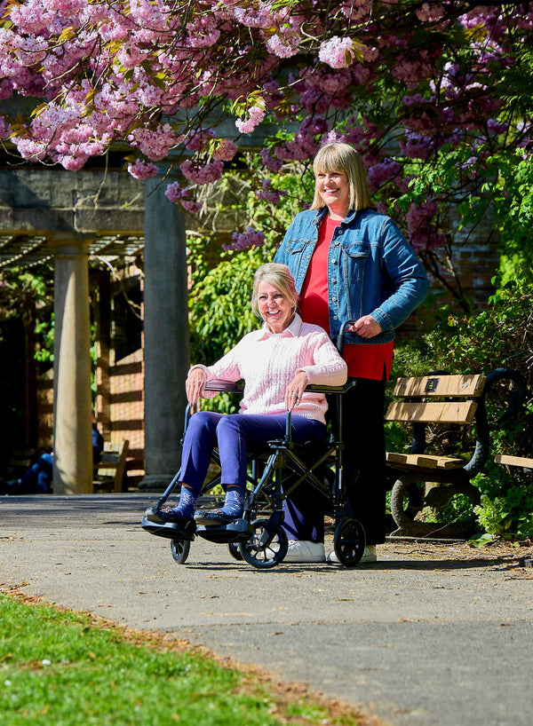 CareCo Fold and Go Wheelchair with Carry Bag in use