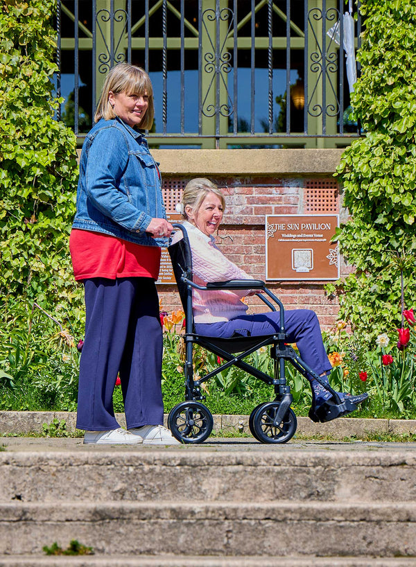 CareCo Fold and Go Wheelchair with Carry Bag in use