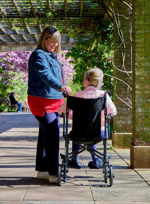 CareCo Fold and Go Wheelchair with Carry Bag in use