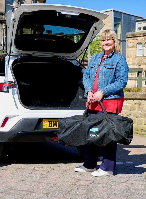 CareCo Fold and Go Wheelchair with Carry Bag in use