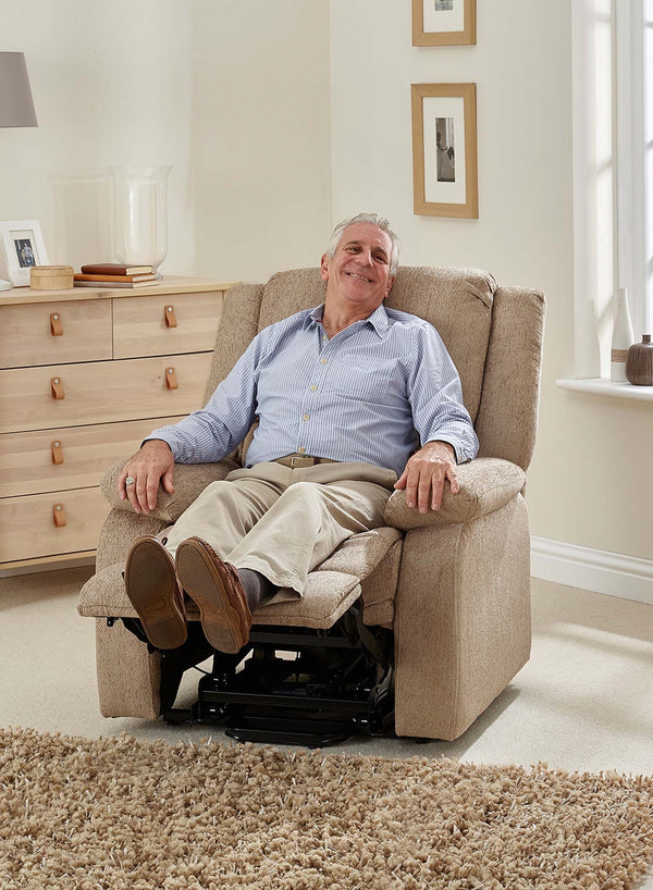 MaxiComfort Oasis Fabric Riser Recliner in use