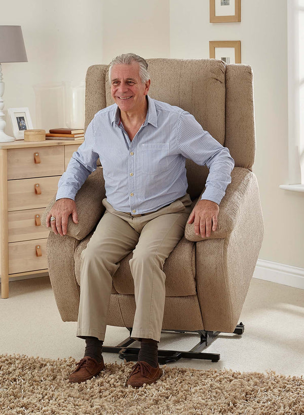 MaxiComfort Oasis Fabric Riser Recliner in use