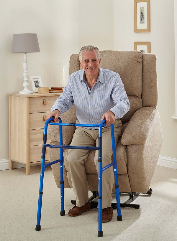 MaxiComfort Oasis Fabric Riser Recliner in use