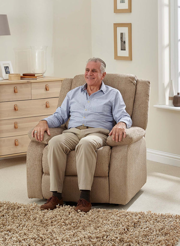 MaxiComfort Oasis Fabric Riser Recliner in use
