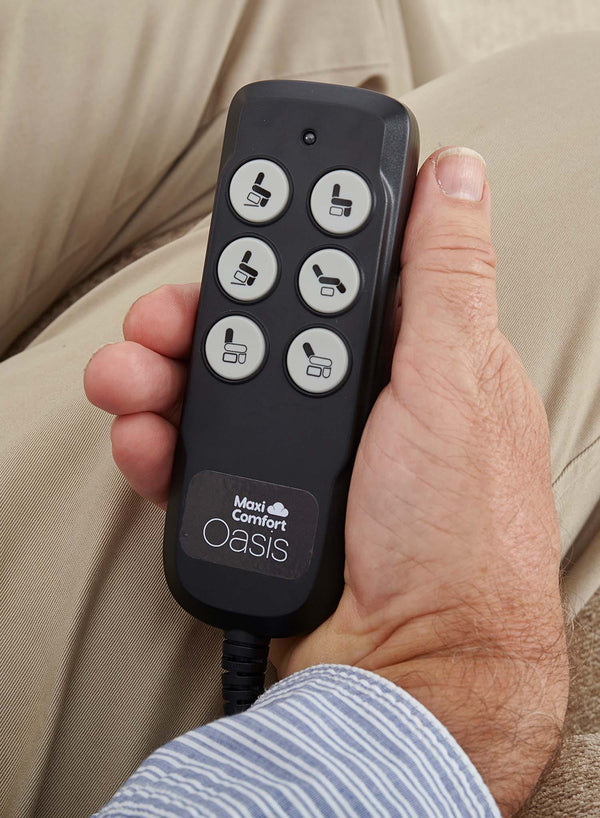 MaxiComfort Oasis Fabric Riser Recliner in use