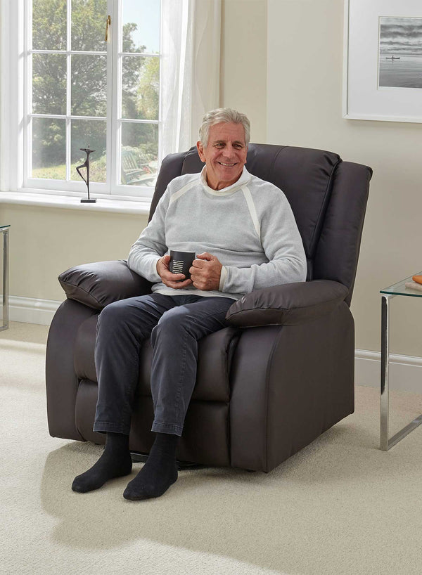 MaxiComfort Oasis Leather Riser Recliner in use