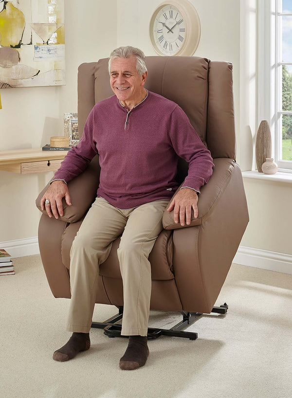 MaxiComfort Oasis Leather Riser Recliner in use