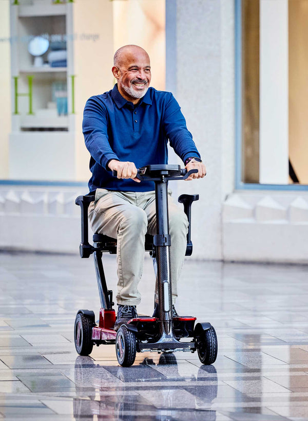 Pride GoGo Carbon Folding Scooter in use