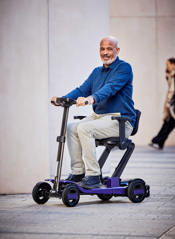 Pride GoGo Carbon Folding Scooter in use