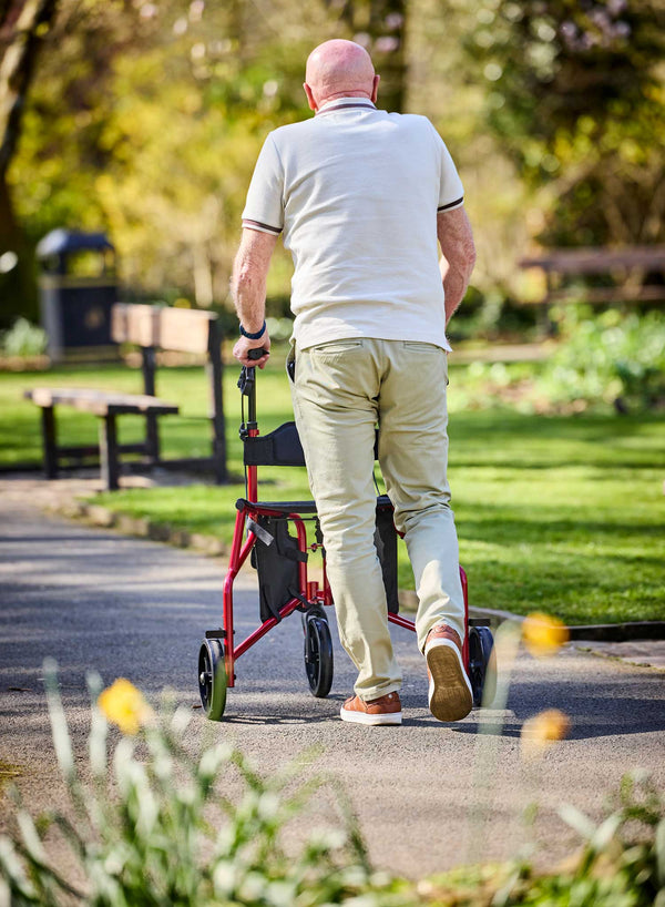 CareCo Triance Tri-Walker with Seat in use