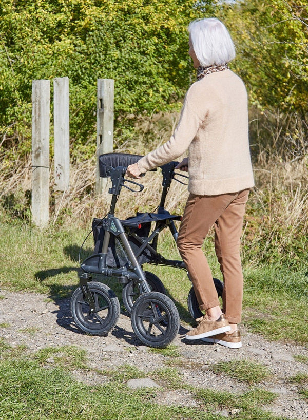 Traxion Outdoor Rollator in use