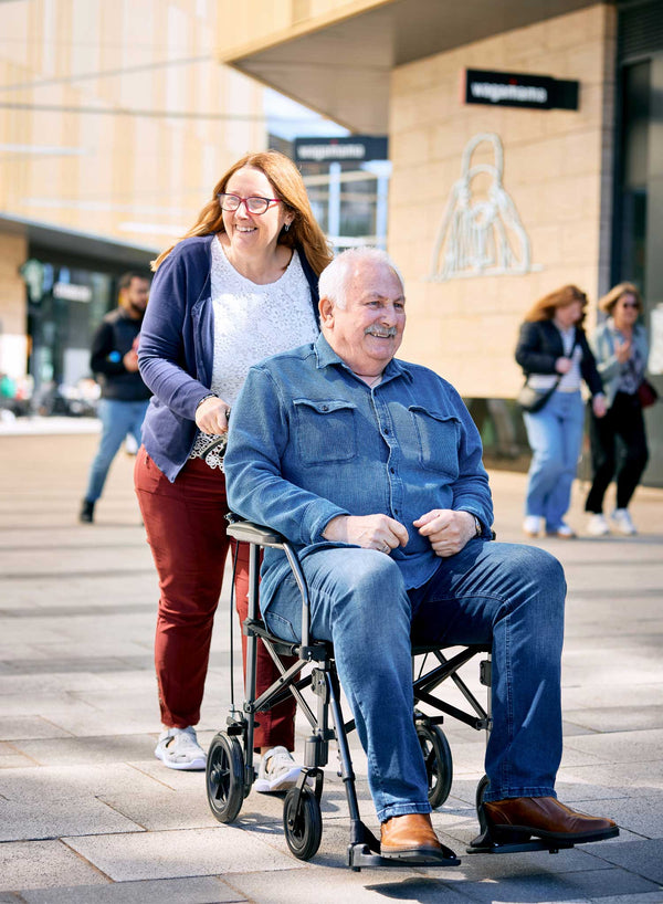 CareCo Travel Air Compact Wheelchair in use