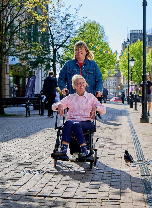 CareCo Fold and Go Wheelchair with Carry Bag in use